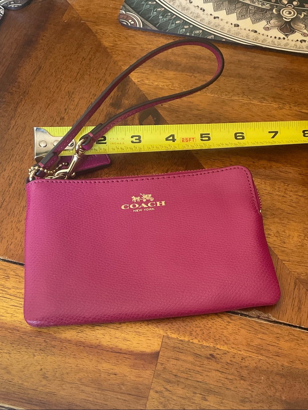 COACH Magenta Leather Wristlet with Gold Logo
